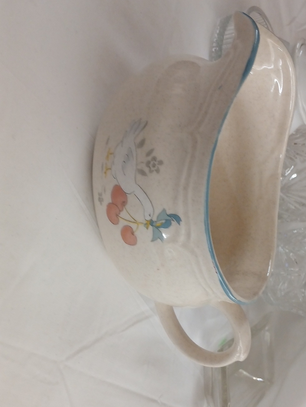 Cream Ceramic Pitcher with Blue Trim and Dove Motif